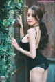 Beautiful Pichana Yoosuk shows off her figure in a black swimsuit (19 photos)